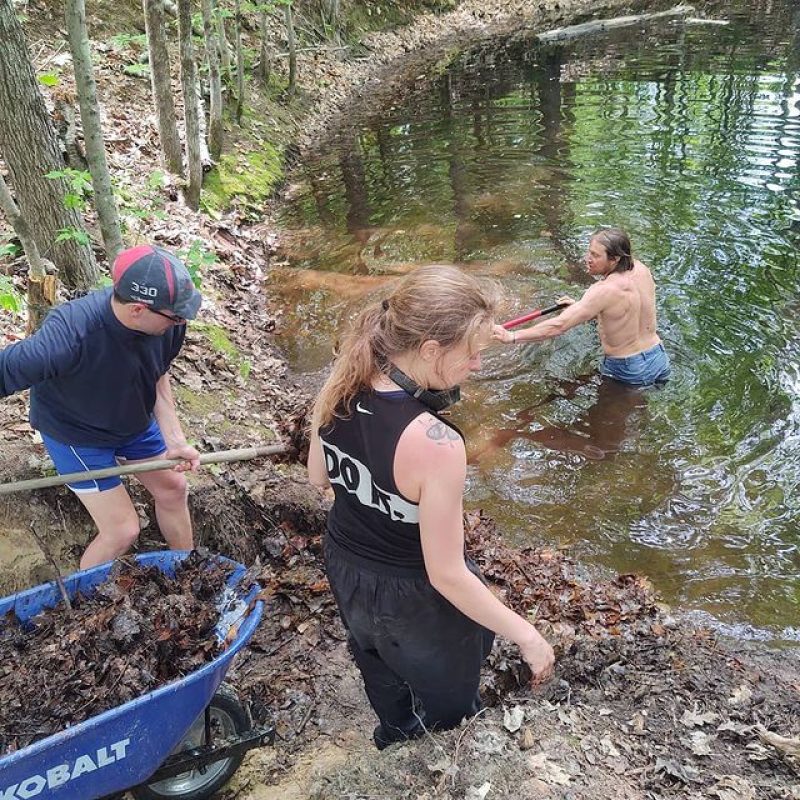 Perchers working to clean out the pond