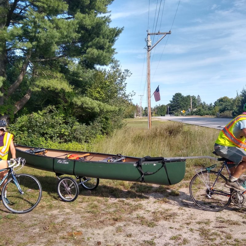 Taking the canoe for a trip on the bike trailer!